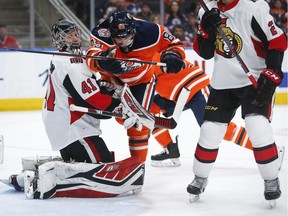 Ottawa Senators goalie Craig Anderson pushes the Edmonton Oilers' Sam Gagner away during the second period in Edmonton on Saturday, March 23, 2019.