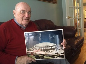 Andrew (Andy) Haydon shows a photo of his plan for a stadium at Lebreton Flats.