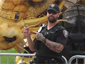 Ottawa police motorcycle officer and blogger The Bearded Cop (@BeardedCop) in front of Long Ma, the dragon-horse in 2017.