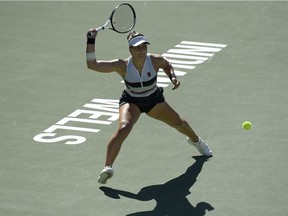 Bianca Andreescu, of Canada, returns a shot to Angelique Kerber, of Germany, during the women's final at the BNP Paribas Open tennis tournament Sunday, March 17, 2019, in Indian Wells, Calif.