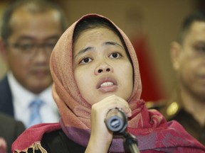 Indonesian Siti Aisyah talks during a press conference at foreign minister office in Jakarta, Indonesia, Monday, March 11, 2019. The Indonesian woman held two years on suspicion of killing North Korean leader's half brother Kim Jong Nam was freed from custody Monday after prosecutors unexpectedly dropped the murder charge against her.