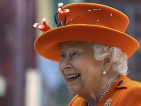 Britain's Queen Elizabeth II reacts during a visit to the Science Museum in London, Thursday March 7, 2019. The Science Museum will announce its upcoming summer exhibitions Thursday.