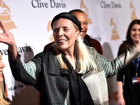 FILE - In this Feb. 7, 2015 file photo, Joni Mitchell arrives at the 2015 Clive Davis Pre-Grammy Gala in Beverly Hills, Calif. Mitchell's "Morning Glory On the Vine: Early Songs and Drawings," will be published Oct. 22, 2019.