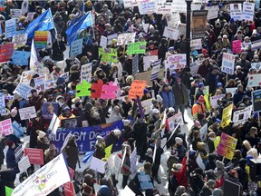 Hundreds of parents, therapists and union members gather outside Queen's Park, in Toronto on Thursday, March 7, 2019, to protest the provincial government's changes to Ontario's autism program.