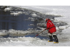 Ottawa city crews blasting ice south of the Minto bridges on the Rideau River in Ottawa Monday March 4, 2019.