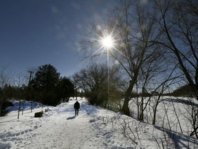 A man walk along the Rideau River in Ottawa Monday March 4, 2019. A new winter trail along the Rideau River opened on Saturday for residents to enjoy just before the snowy weather wraps up. Residents can now snowshoe, cross-country ski or use their fatbikes along the one-kilometre stretch from from Hurdman's Bridge to Montreal Road.