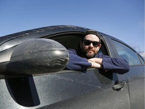 Neil Mann poses for a photo in Ottawa Tuesday March 19, 2019. Neil is an Uber driver who had his driver's license suspended after he didn't pay a $110 ticket because his license plate was illegible in January. His passenger had to climb into the driver's seat an help him get to a Service Ontario location where the issue was handled and his license was reinstated.   Tony Caldwell