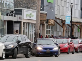 Vehicles are parked in front of Mountain Equipment Co-op on Richmond Road