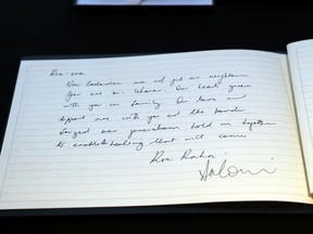 This handout photograph taken and released on March 20, 2019 by the Australian Prime Minister's Office shows a handwritten message from Prime Minister Scott Morrison in a condolence book at the New Zealand High Commission in Canberra, following the mass shooting attacks at two mosques in Christchurch that killed 50 Muslim worshippers.