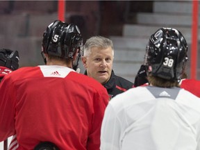 Marc Crawford, middle, has been serving as interim head coach of the Senators since Guy Boucher was relieved of his duties on March 1.