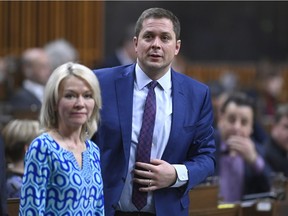 Conservative Leader Andrew Scheer rises to vote during a marathon voting session as it continues into the night in the House of Commons on Parliament Hill on Wednesday, March 20, 2019.