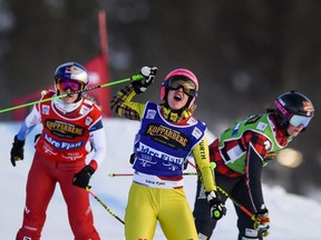 Germany's Heidi Zacher gestures on winning after a tight race, in front of Marielle Thompson of Canada, right, and Fanny Smith of Switzerland, left, during the women's final FIS Freestyle Ski Cross World Cup event in Idre, Sweden, Saturday Jan. 19. 2019. (Pontus Lundahl / TT via AP) ORG XMIT: WRC809