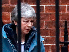 Britain's Prime Minister Theresa May leaves from the rear of 10 Downing Street in London on March 20, 2019.