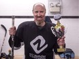 Bruce Engel holds the trophy and puck he was presented after scoring his 500th career goal.