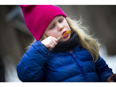 Four-year-old Charlotte Natynczyk enjoyed the taffy at the Vanier Sugar Festival on Saturday.