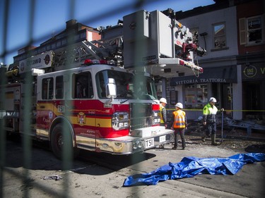 Fire crews and investigators were on the scene of Vittoria Trattoria restaurant Saturday April 13, 2019, where a four-alarm fire happened Friday.   Ashley Fraser/Postmedia