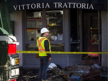 Fire crews and investigators were on the scene of Vittoria Trattoria restaurant Saturday April 13, 2019, where a four-alarm fire happened Friday.   Ashley Fraser/Postmedia