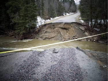 The scene of the washed out road where Louise Séguin Lortie, 72, died after her car plunged into a washed out section of Chemin Bronson Bryant in Pontiac.