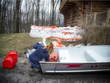 Shirley Laws shows the preparations they have made to get their Masson-Angers home ready for the rising water of the Ottawa River.