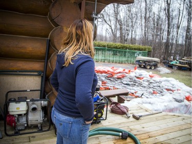 Shirley Laws shows the preparations they have made to get their Masson-Angers home ready for the rising water of the Ottawa River.