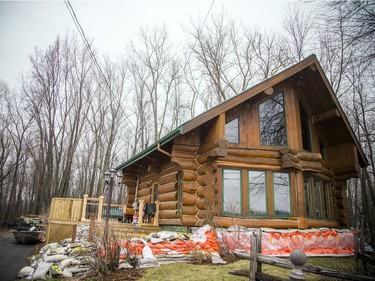 Shirley Laws shows the preparations they have made to get their Masson-Angers home ready for the rising water of the Ottawa River.