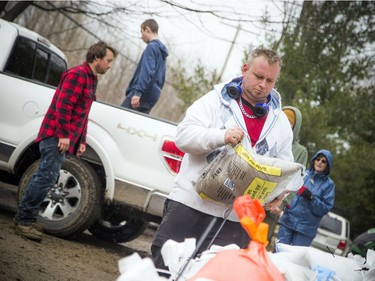Crews were preparing homes for the raising Ottawa River in Masson-Angers Saturday.