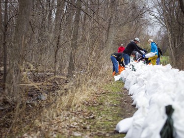 Volunteers came out to sandbag along the Ottawa River Pathway where the Ottawa River was creeping close to breaking over which would cause major flooding in the Britannia area, Saturday, April 27, 2019.