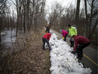 Volunteers came out to sandbag along the Ottawa River Pathway where the Ottawa River was creeping close to breaking over which would cause major flooding in the Britannia area, Saturday, April 27, 2019.