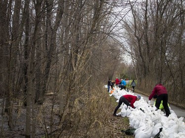 Volunteers came out to sandbag along the Ottawa River Pathway where the Ottawa River was creeping close to breaking over which would cause major flooding in the Britannia area, Saturday, April 27, 2019.