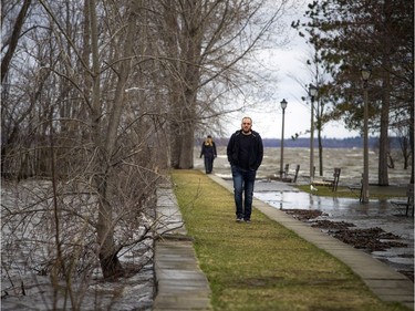 People walk along a limited amount of path in Britannia Park Saturday, April 27, 2019.