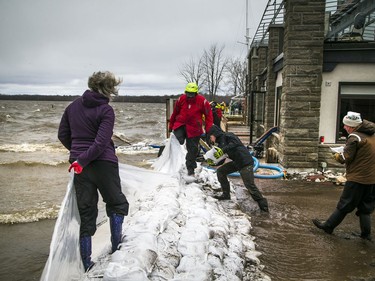 People were building a wall of sandbags and plastic to try to hold back the Ottawa River near the Britannia Yacht Club Saturday, April 27, 2019.