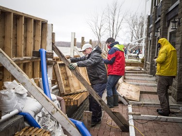 People were building a wall to try to hold back the Ottawa River from the Britannia Yacht Club Saturday, April 27, 2019.