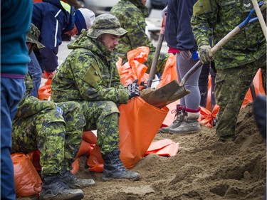 Canadian Forces personnel were helping fill sandbags in Aylmer Saturday, April 27, 2019.   Ashley Fraser/Postmedia