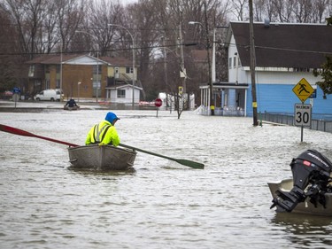 Boats were the only way to access certain areas near Rue Saint-Louis Saturday, April 27, 2019.   Ashley Fraser/Postmedia