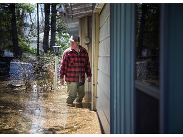 Wes Dodds asses the water levels hitting his flooded summer home. A state of emergency was declared in Rhoddy's Bay, west of Arnprior, on the Ottawa River Sunday, April 28, 2019.