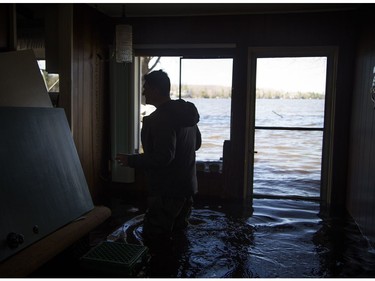 Kevin Dodds asses the water levels hitting his parents summer home. A state of emergency was declared in Rhoddy's Bay, west of Arnprior, on the Ottawa River Sunday, April 28, 2019.