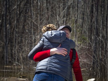 Doug MacCrae gets a hug from a friend. A state of emergency was declared in Rhoddy's Bay, west of Arnprior, on the Ottawa River Sunday, April 28, 2019.