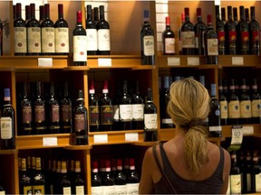 A customer browses wine for sale at a Liquor Control Board of Ontario (LCBO) store in Toronto. The provincial government intends to make it easier to buy beer and wine.