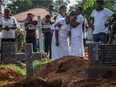 NEGOMBO, SRI LANKA - APRIL 23: A woman is overcome with grief during a funeral for one of the victims killed in the Easter Sunday attack on St Sebastian's Church, on April 23, 2019.