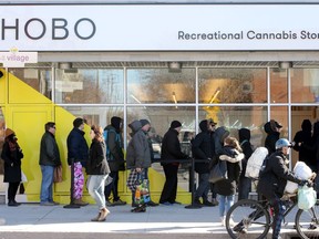People line up outside the Hobo Recreational Cannabis Store on Bank Street April 1, the first day legal pot shops opened in Ottawa.