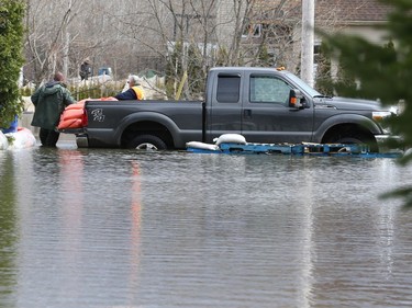 Homes and streets of Saint-André-Avellin are flooded by the the Petite-Nation river on Wednesday.