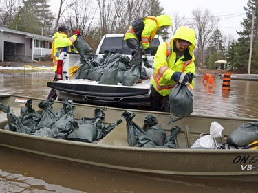 City of Ottawa employees bring sand bags to homes on Boisé Lane that are being flooded by the Ottawa River in Cumberland,  April 26, 2019.