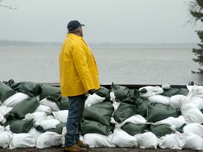 Volunteer Rob Marshall stops for a moment in the rain at one of the vulnerable areas around Britannia Bay.