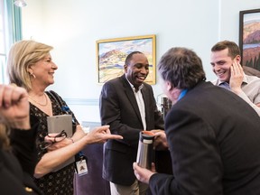Rawlson King meets some of his fellow councillors including, from left, Carol Anne Meehan, Jean Clouthier (back to camera) and Mathieu Fleury on Tuesday, April 16, 2019.