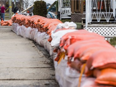 Sand bags to protect homes against rising flood waters along Rue Moreau in Gatineau, Quebec on April 22, 2019.