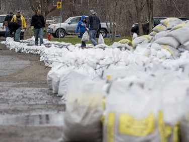 Residents build a wall of sandbags along Rue Lamoureux in Gatineau on April 26, 2019.