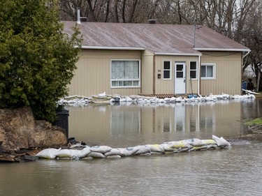 A home on Rue Coté in Gatineau surrounded by water on April 26, 2019.