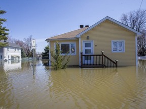 An abandoned house in the flooded Pointe-Gatineau neighbourhood of the city on Sunday.