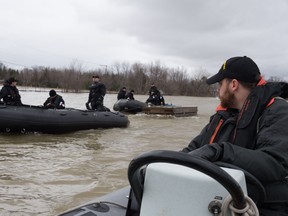 Navy reservists using boats in Rigaud, Quebec. Canadian Forces photo.