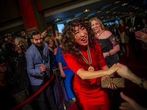 Actress Sandra Oh, recipient of the National Arts Centre Award, arrives on the red carpet, greeting fans.